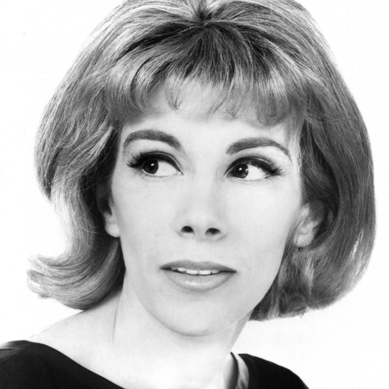 Young Joan Rivers looking off-camera in black and white photo