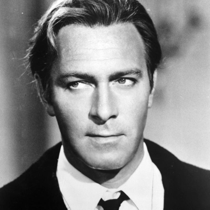 Actor Christopher Plummer looks away from the camera in a black and white photo from early in his career.