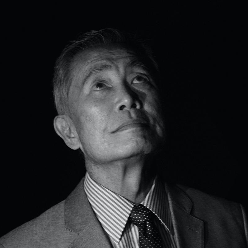 Actor and activist George Takei looks upward in this black and white portrait taken in 2016