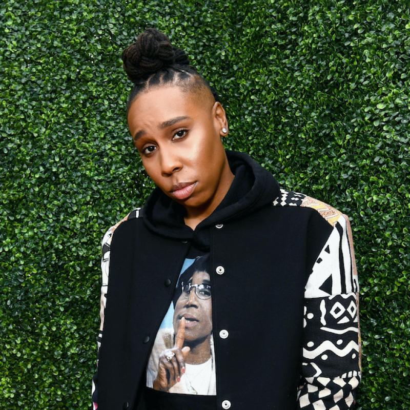 Actress and filmmaker Lena Waithe poses in front of a green living wall