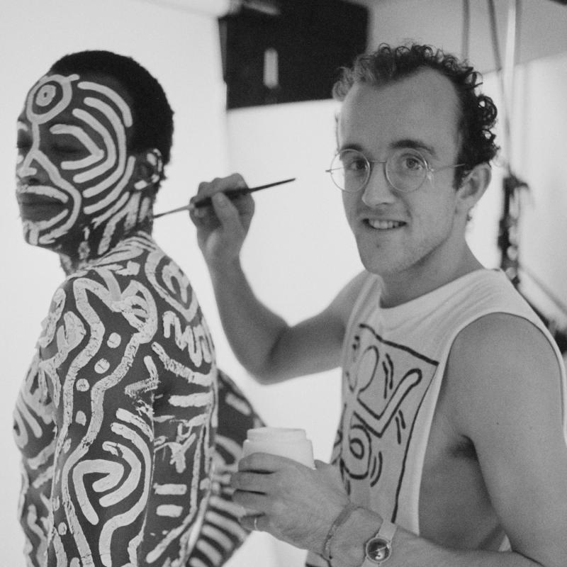 Visual artist Keith Haring applies body paint to dancer Bill T. Jones