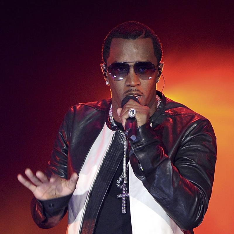 Rapper and music producer Diddy on-stage with a mic in his hand